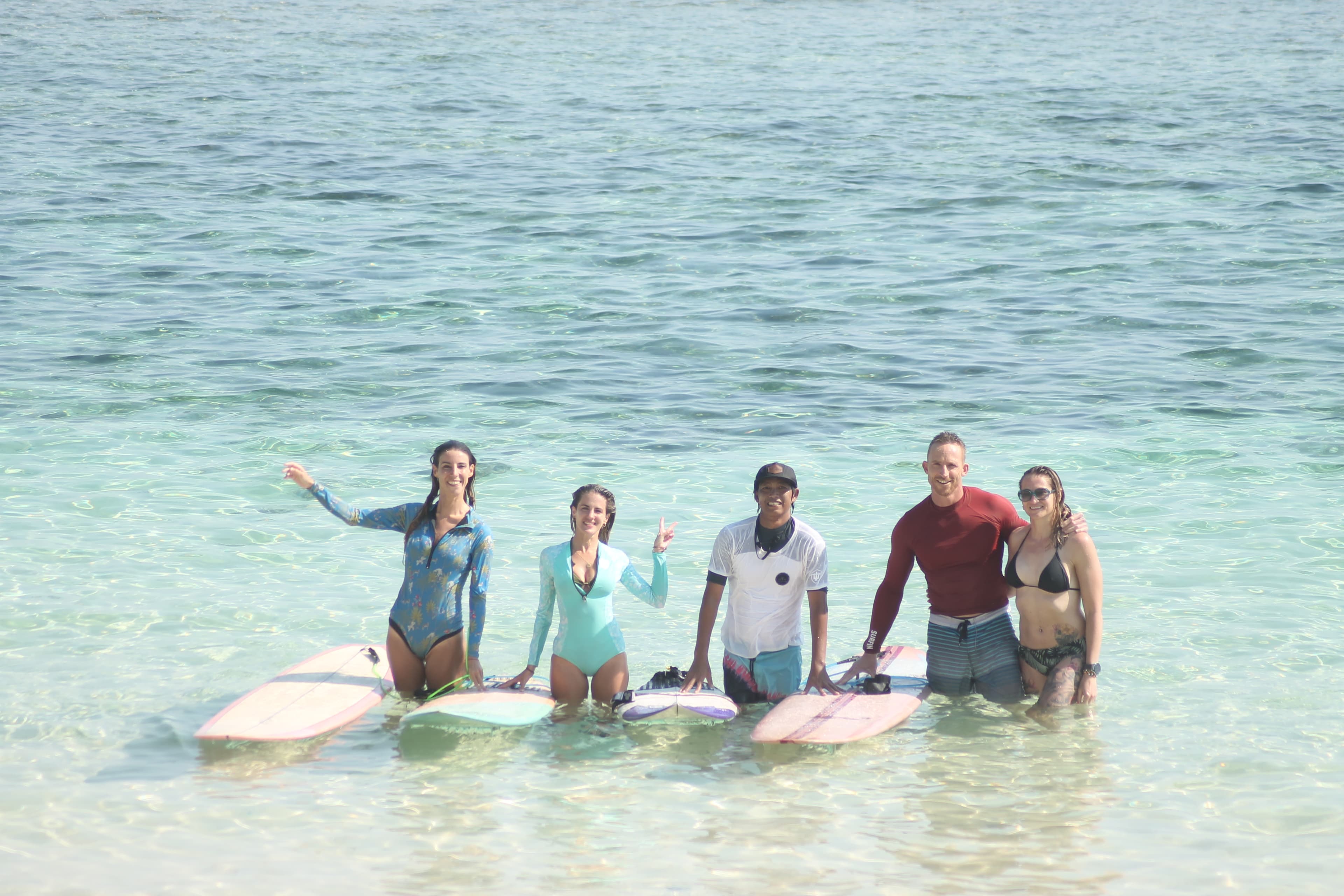 Group surf lesson with three beginners at Balangan Beach, Bali