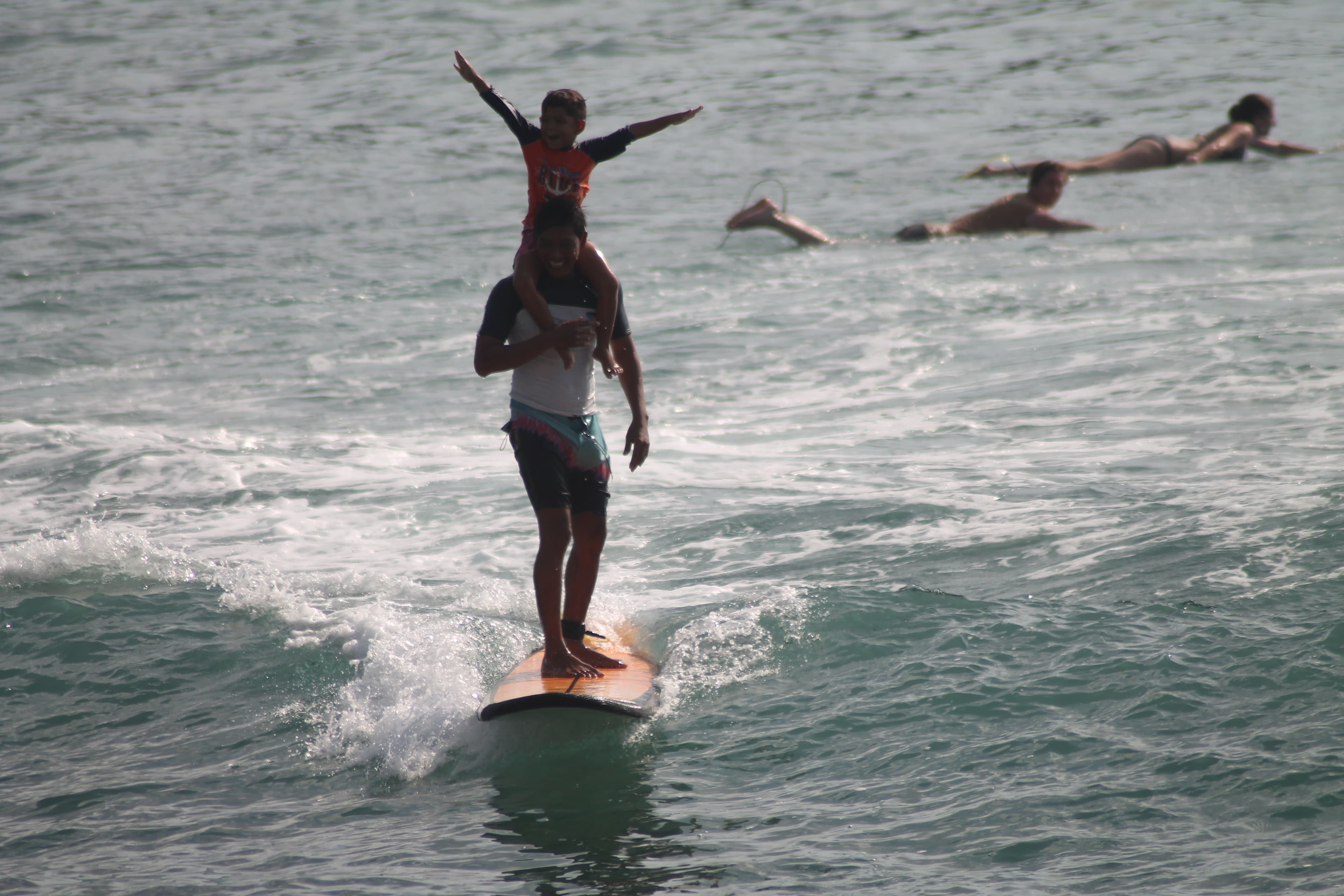 Student catching their first wave at Balangan Beach