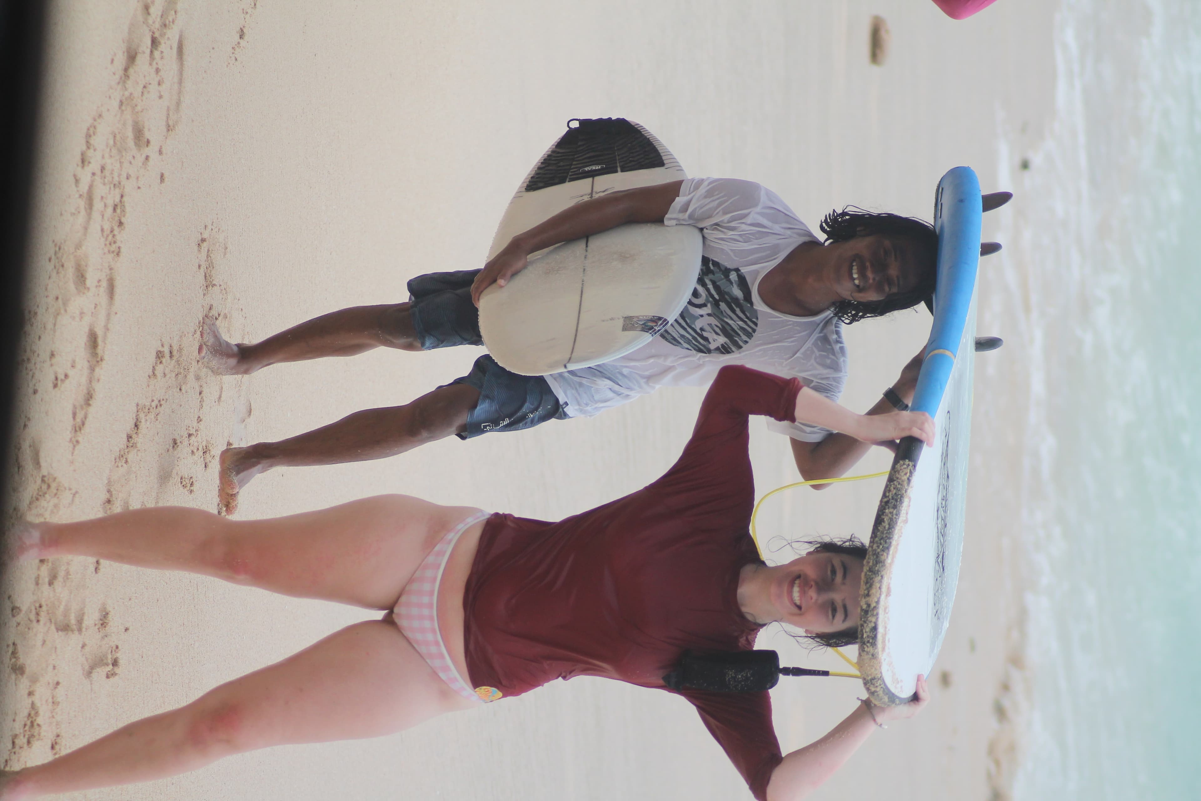Beginner standing up on a wave at Balangan Beach, Bali
