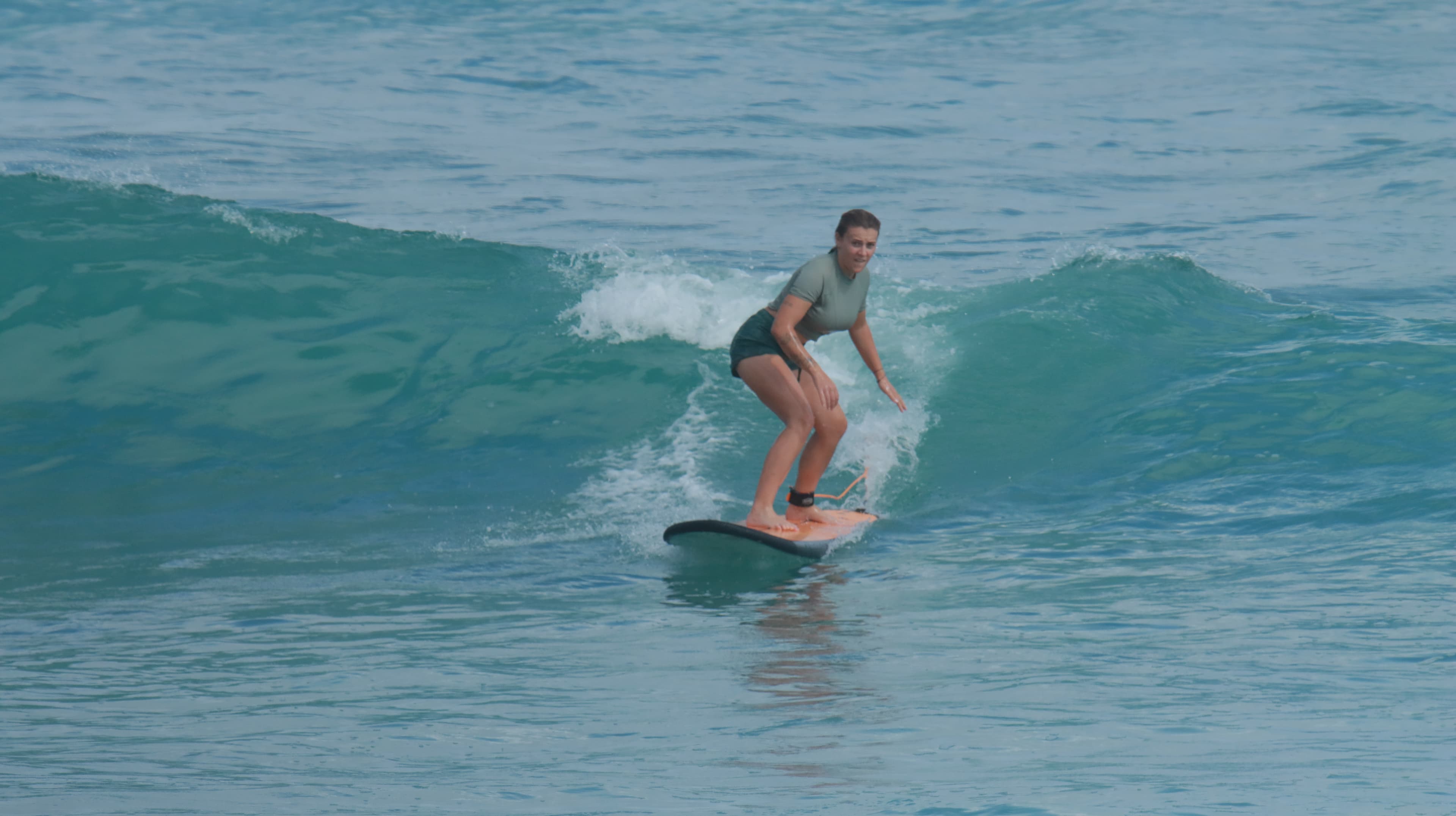 Aerial view of a surfer on a wave at Uluwatu, Bali